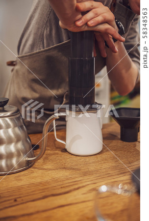 Barista is making alternative coffee with Barista is making alternative coffee with 58348563