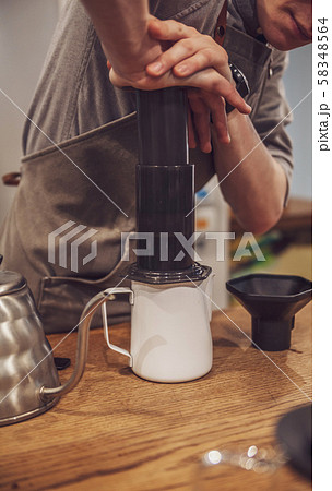 Barista is making alternative coffee with Barista is making alternative coffee with 58348564