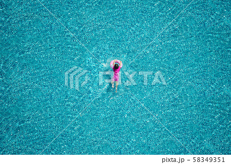 Top view of girl swimming in the pool. Top view of girl swimming in the pool. 58349351