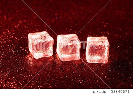 ice cubes on a reflections red light. ice cubes on a reflections red light. 58349671