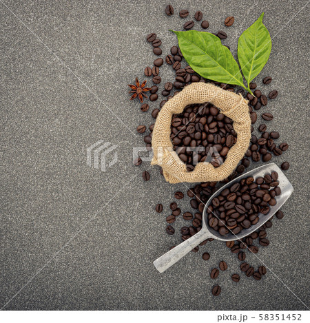 Dark roasted coffee beans on stone background. Top Dark roasted coffee beans on stone background. Top 58351452
