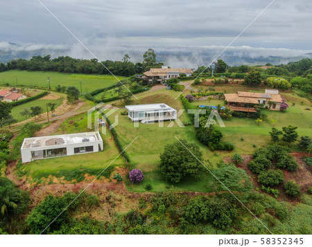 Aerial view of luxury villa in tropical valley Aerial view of luxury villa in tropical valley 58352345