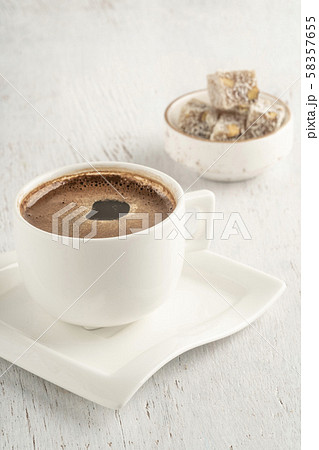 A cup of Turkish coffee and delight on a wooden 58357655