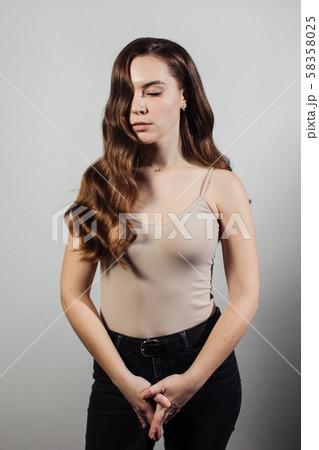Closeup of female hands of hairdresser or coiffeur makes hairstyle. Hair Closeup of female hands of hairdresser or coiffeur makes hairstyle. Hair 58358025