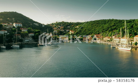 Low altitude aerial shot of Kioni Bay of Ithaca island, Greece 58358176