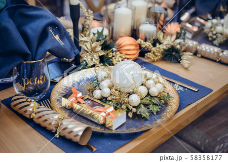 Christmastime table setting, festive dinnerware 58358177