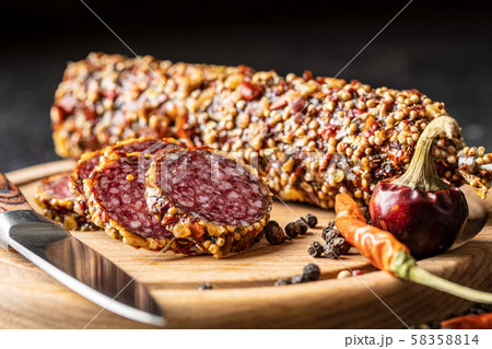 Sliced spicy salami sausage 58358814
