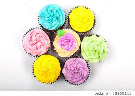Overhead View of Cupcakes With Colorful Icing or Frosting Overhead View of Cupcakes With Colorful Icing or Frosting 58359119