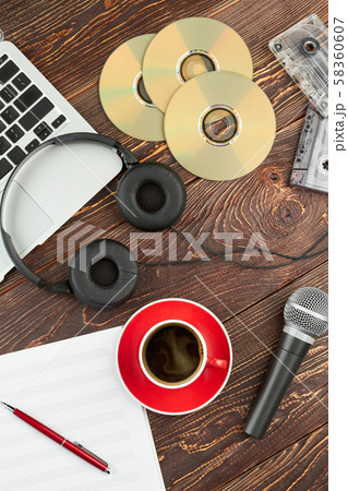 Wooden background with audio devices. Wooden background with audio devices. 58360607