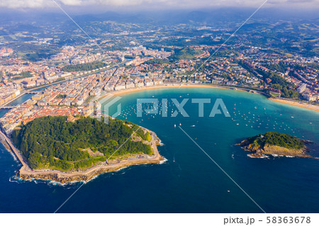High view of San-Sebastian with Beach of La Concha and boats at sea High view of San-Sebastian with Beach of La Concha and boats at sea 58363678