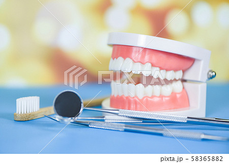 dentist tools with bamboo toothbrush dentures 58365882