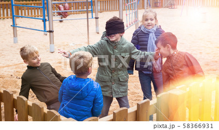 Children play in the blind man's buff 58366931