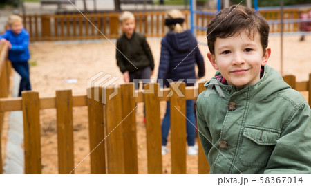 Cheerful boy on the background of the playground 58367014