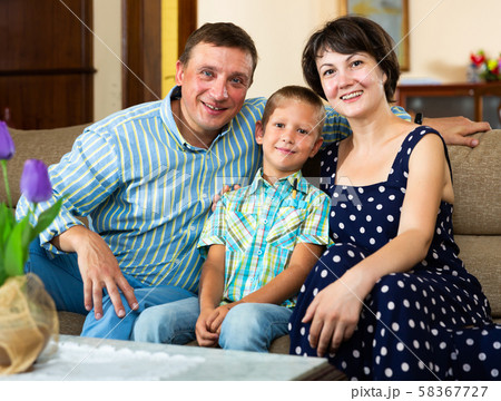 Portrait of smiling family in domestic interior 58367727