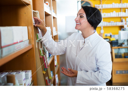 Female pharmacist in store Female pharmacist in store 58368275