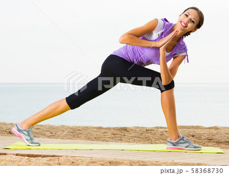 Girl training yoga poses 58368730