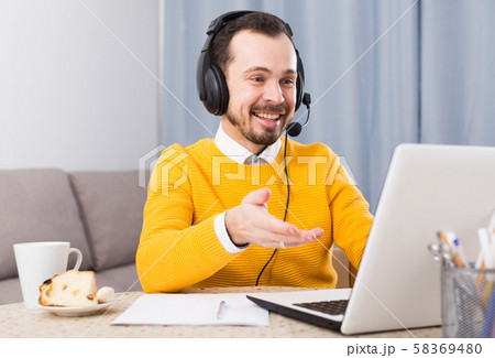 Man studying remotely at home Man studying remotely at home 58369480