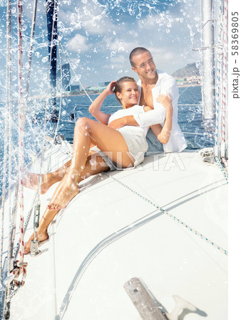 Couple sailing on yacht along Spanish coast Couple sailing on yacht along Spanish coast 58369805