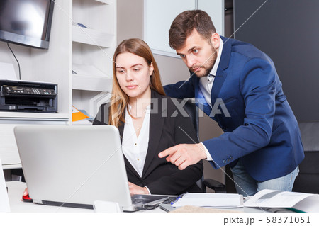 Administrator and seller at workplace in showroom Administrator and seller at workplace in showroom 58371051