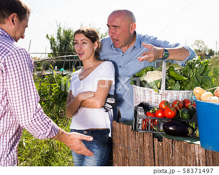 Farm neighbors quarrel over farm backyard Farm neighbors quarrel over farm backyard 58371497