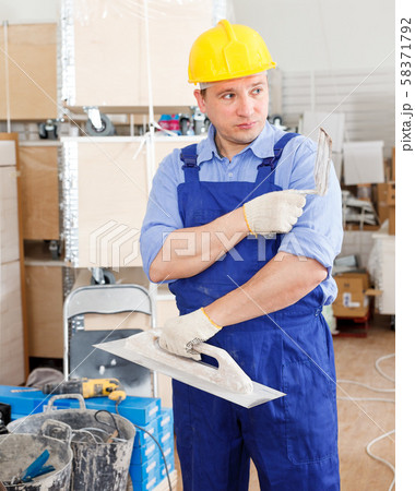 Plasterer working indoors 58371792