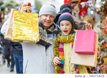 Happy family after shopping on Christmas market 58371826
