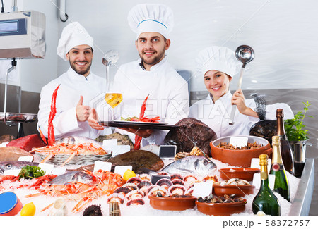 chefs offering fresh marine products for tasting chefs offering fresh marine products for tasting 58372757