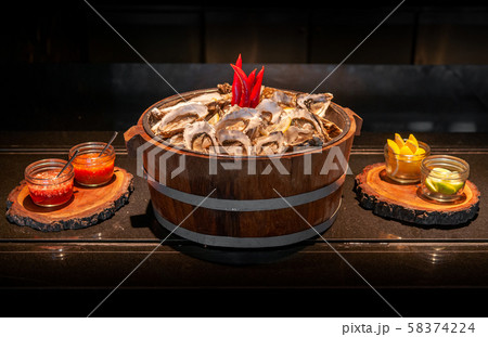 Fresh whole marine Fine de claire oysters in oak Fresh whole marine Fine de claire oysters in oak 58374224