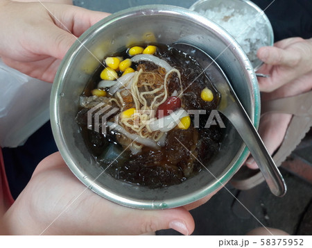 Chinese cold dessert with jelly grass and red bean and dried longan and sticky flour and noodle, corn, Coconut jelly, Ginkgo, Lotus seeds Chinese cold dessert with jelly grass and red bean and dried longan and sticky flour and noodle, corn, Coconut jelly, Ginkgo, Lotus seeds 58375952