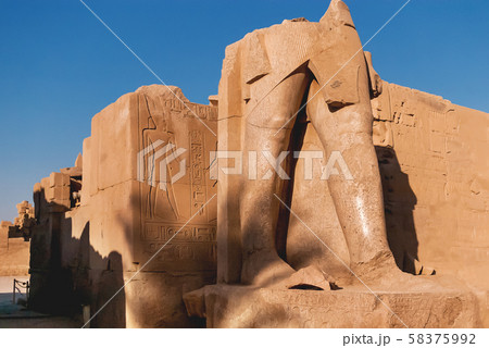 Ruined statue in Karnak Temple Complex, famous architectural landmark in Luxor, Egypt. 58375992