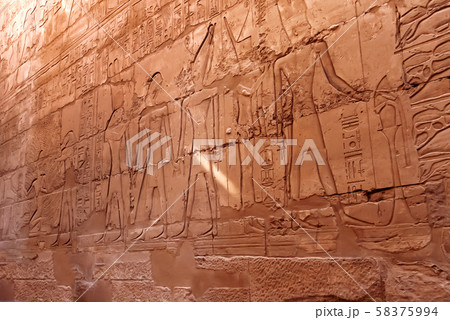 Hieroglyphs on wall of Karnak Temple Complex, famous architectural landmark in Luxor, Egypt. 58375994