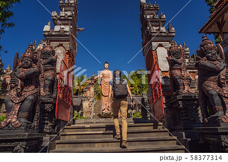 Young man tourist in budhist temple Brahma Vihara Arama Banjar Bali, Indonesia Young man tourist in budhist temple Brahma Vihara Arama Banjar Bali, Indonesia 58377314