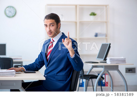 Young male businessman sitting in the office 58381589