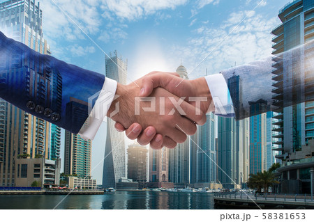 Businessman shaking hands in agreement Businessman shaking hands in agreement 58381653