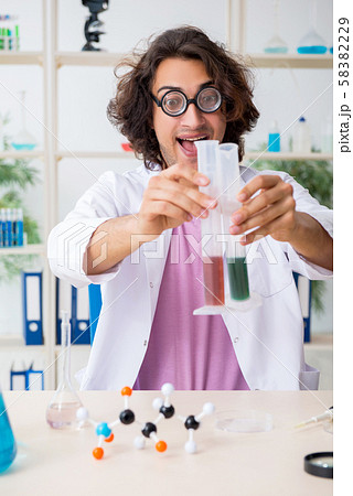 Funny male chemist working in the lab Funny male chemist working in the lab 58382229