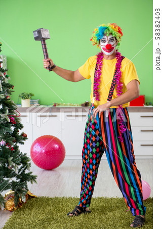Funny clown in Christmas celebration concept Funny clown in Christmas celebration concept 58382403
