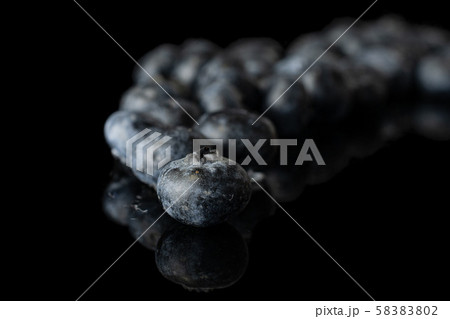 Fresh blueberry isolated on black glass Fresh blueberry isolated on black glass 58383802