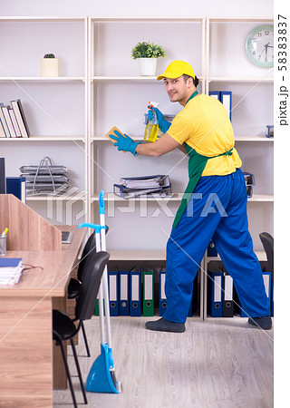 Young male contractor cleaning the office 58383837