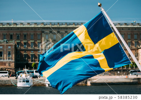 Stockholm, Sweden. Waving Swedish Flag In Stockholm Street 58385230