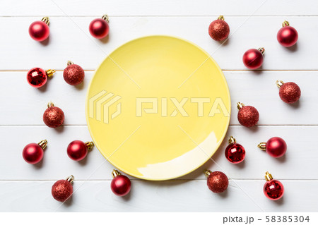 Top view of festive plate with red baubles on Top view of festive plate with red baubles on 58385304