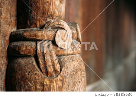 Borgund, Norway. Carved Details Of Famous Wooden Norwegian Landmark Stavkirke. Ancient Old Wooden Borgund, Norway. Carved Details Of Famous Wooden Norwegian Landmark Stavkirke. Ancient Old Wooden 58385630