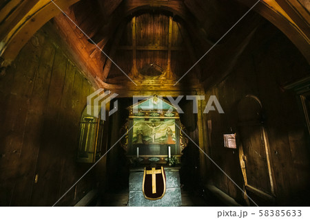 Borgund, Norway. Interior Of Famous Wooden Norwegian Landmark Stavkirke. Ancient Old Wooden Triple Borgund, Norway. Interior Of Famous Wooden Norwegian Landmark Stavkirke. Ancient Old Wooden Triple 58385633