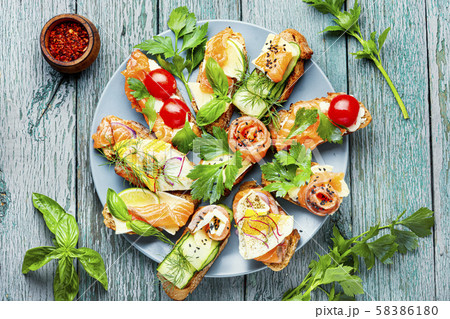 Assorted bruschetta with fish Assorted bruschetta with fish 58386180