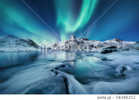 Aurora Borealis, Lofoten islands, Norway. Mountains and frozen ocean. Aurora Borealis, Lofoten islands, Norway. Mountains and frozen ocean. 58386252