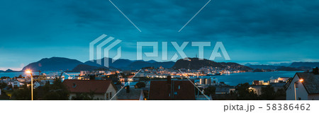 Alesund, Norway. Night Alesund Skyline Cityscape. Historical Center In Summer Evening. Famous Alesund, Norway. Night Alesund Skyline Cityscape. Historical Center In Summer Evening. Famous 58386462