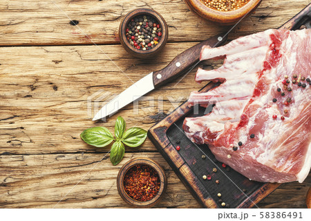 Pork chops on a cutting board 58386491