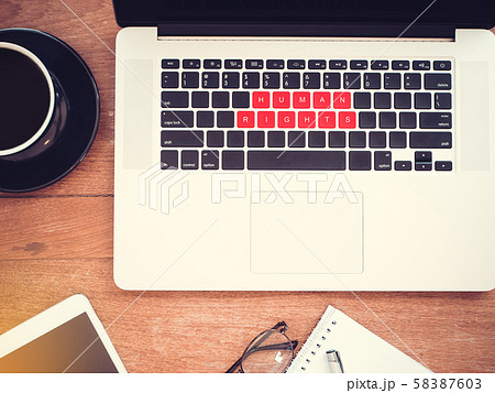 human rights concept. word human rights on red keyboard laptop with vintage effect, flat lay 58387603