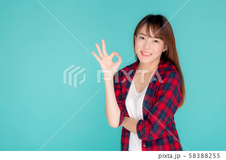 Beautiful portrait young asian woman smiling confident and excited summer holiday isolated Beautiful portrait young asian woman smiling confident and excited summer holiday isolated 58388255