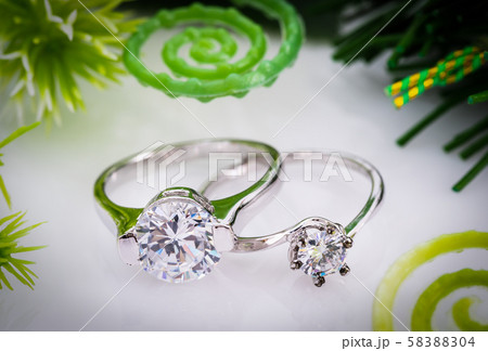 Diamond wedding rings on white background 58388304