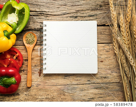 flat lay of blank recipe cooking book and utensils with herbs and colorful bell pepper over wooden background. top view with copy space. food recipe and cooking concept flat lay of blank recipe cooking book and utensils with herbs and colorful bell pepper over wooden background. top view with copy space. food recipe and cooking concept 58389478